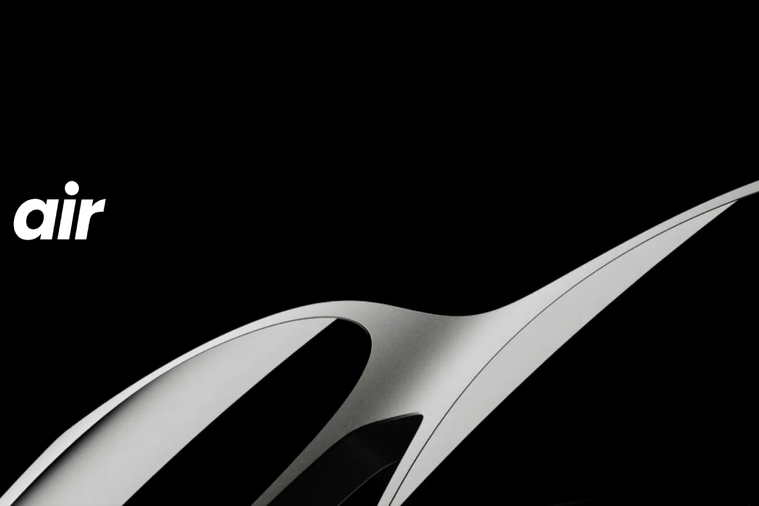 Close-up promotional image of XREAL Air smart glasses, showing the sleek silver frame design on a black background with the word 'air' in white text.